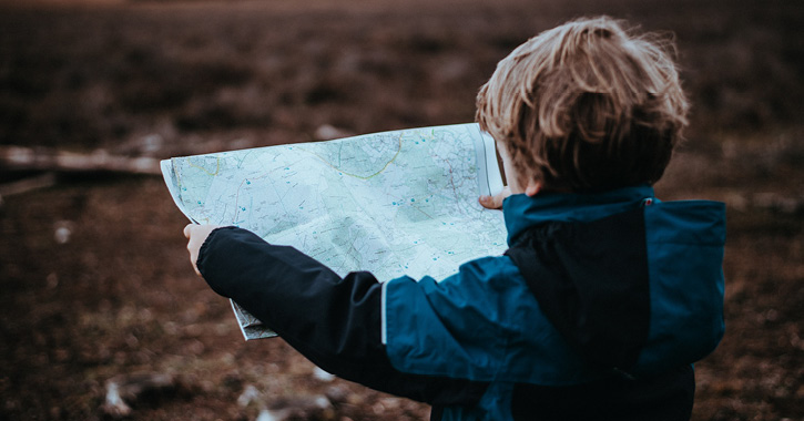 child looking at a map